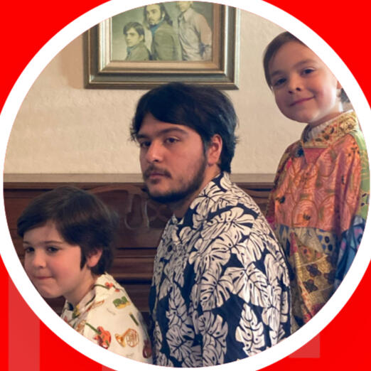 The Desert Wildfires in front of a piano and a picture